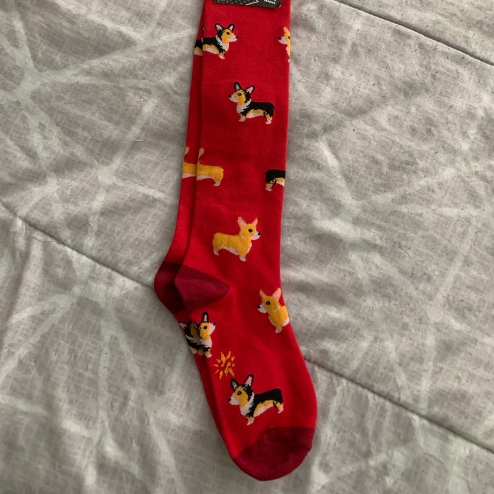 Knee high red socks with corgis
